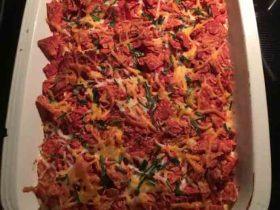 Dorito Chicken Bake with creamy chicken filling, crushed chips, and melted Mexican cheese