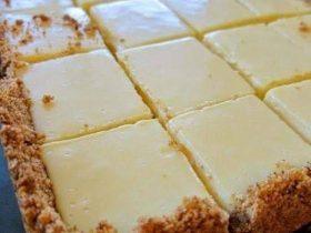 Creamy lemon squares with graham cracker crust and smooth lemon filling