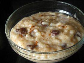 Old-fashioned baked rice pudding with raisins, cinnamon, and nutmeg