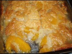 Old-fashioned oven peach cobbler with cinnamon, nutmeg, and golden Bisquick topping