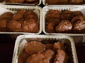 Homemade pecan turtle candy with soft caramel and melted chocolate