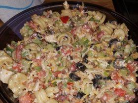 Chicken club pasta salad with rotisserie chicken, bacon, Muenster cheese, tomatoes, vegetables, and avocado