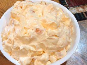 Orange Dreamsicle Salad with mandarin oranges, whipped topping, vanilla pudding, and mini marshmallows