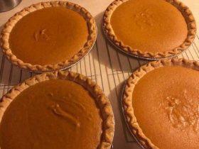 Sweet potato pie with smooth filling and optional pecan glaze in a golden crust