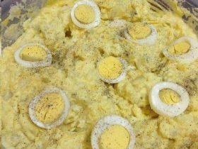 Southern potato salad with mustard dressing, sweet pickle relish, eggs, celery, and paprika