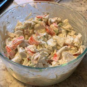 Creamy crab seafood salad with imitation crab, celery, dill and paprika