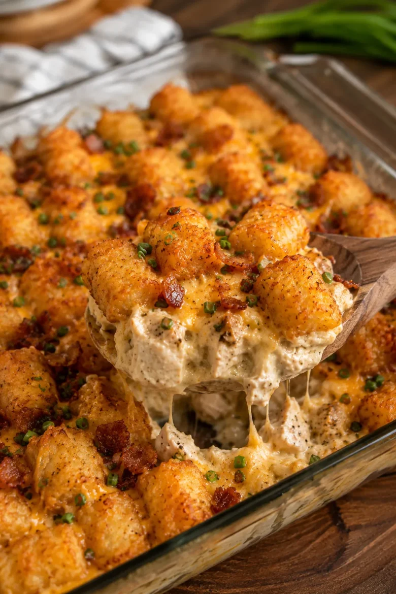 Baked tater tot casserole with ranch chicken, bacon, and melted cheese
