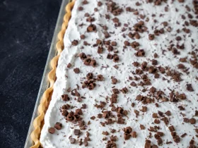 French Silk Slab Pie with creamy chocolate filling and whipped cream topping
