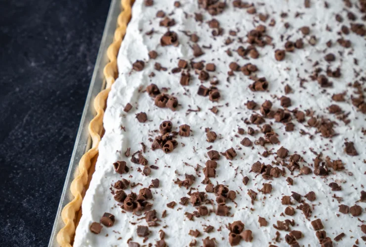 French Silk Slab Pie with creamy chocolate filling and whipped cream topping