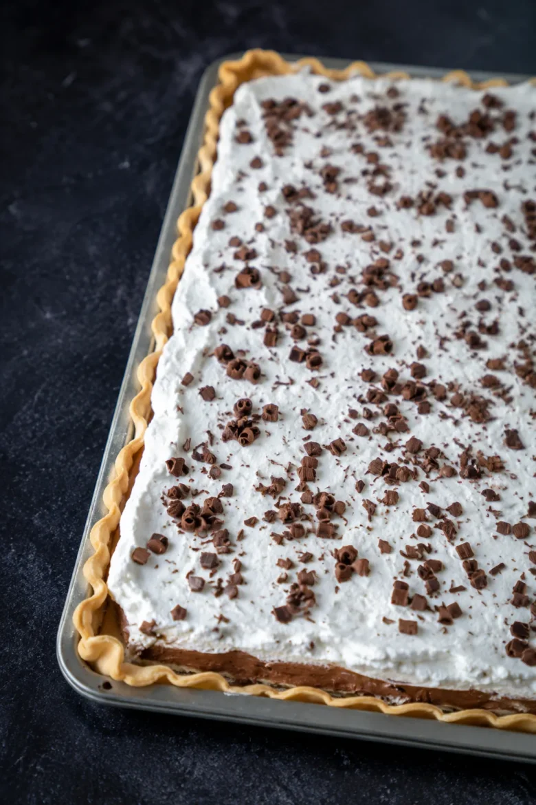 French Silk Slab Pie with creamy chocolate filling and whipped cream topping