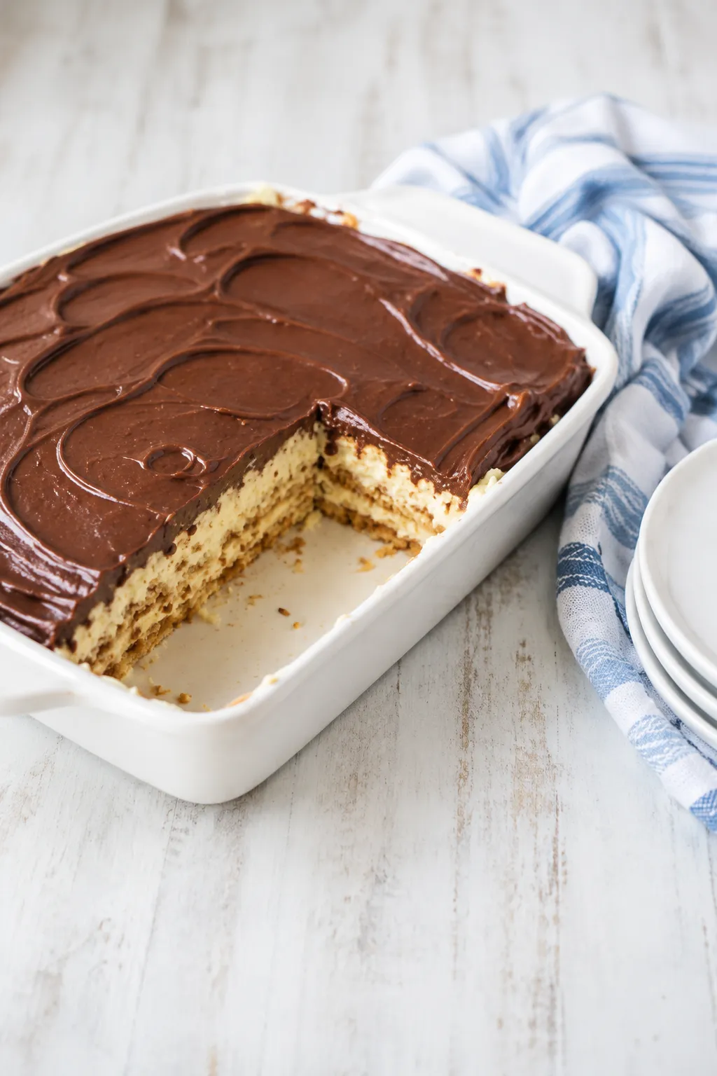 finished no-bake chocolate eclair cake with smooth chocolate topping