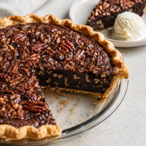 Whole chocolate fudge pecan pie with a rich baked filling and flaky crust