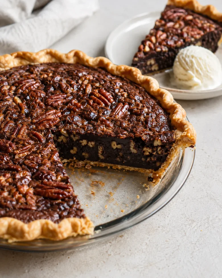 Whole chocolate fudge pecan pie with a rich baked filling and flaky crust