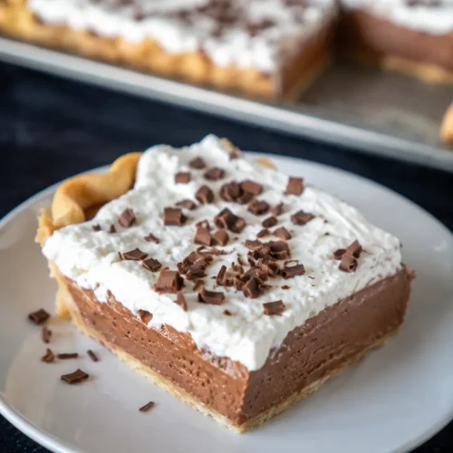 French Silk Slab Pie with creamy chocolate filling and whipped cream topping