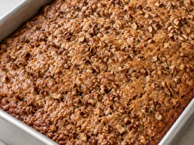 Baked Sweet Alabama Pecan Bread with chopped pecans in a rectangular metal pan