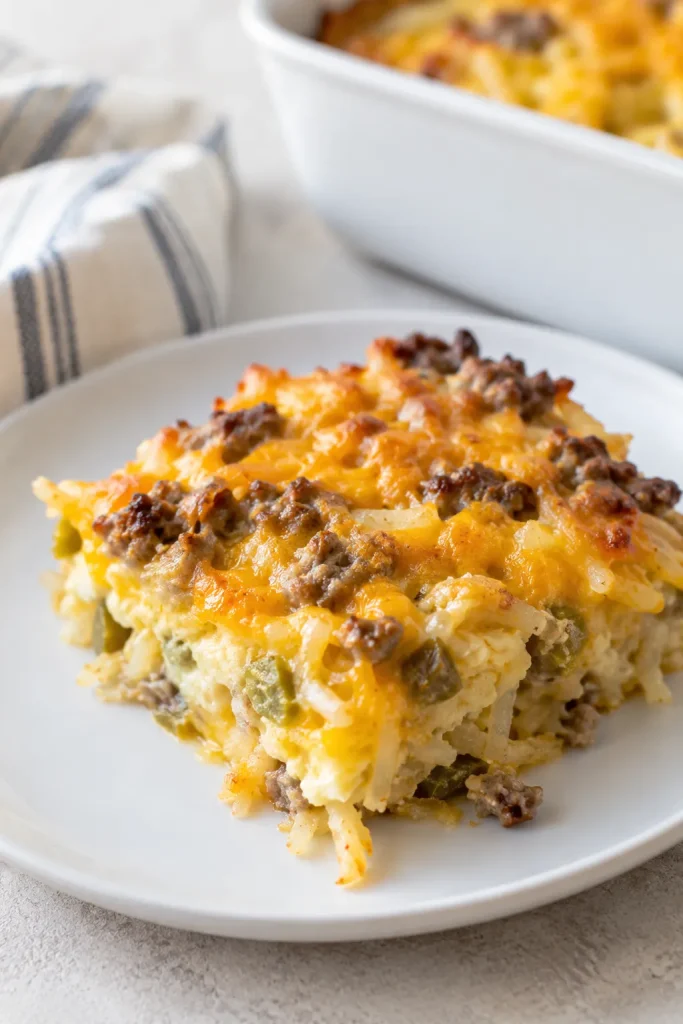 Make-ahead sausage hash brown breakfast casserole served on a plate