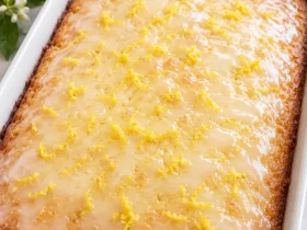 Whole Lemon Cake To Die For with glossy lemon glaze and fresh lemon zest