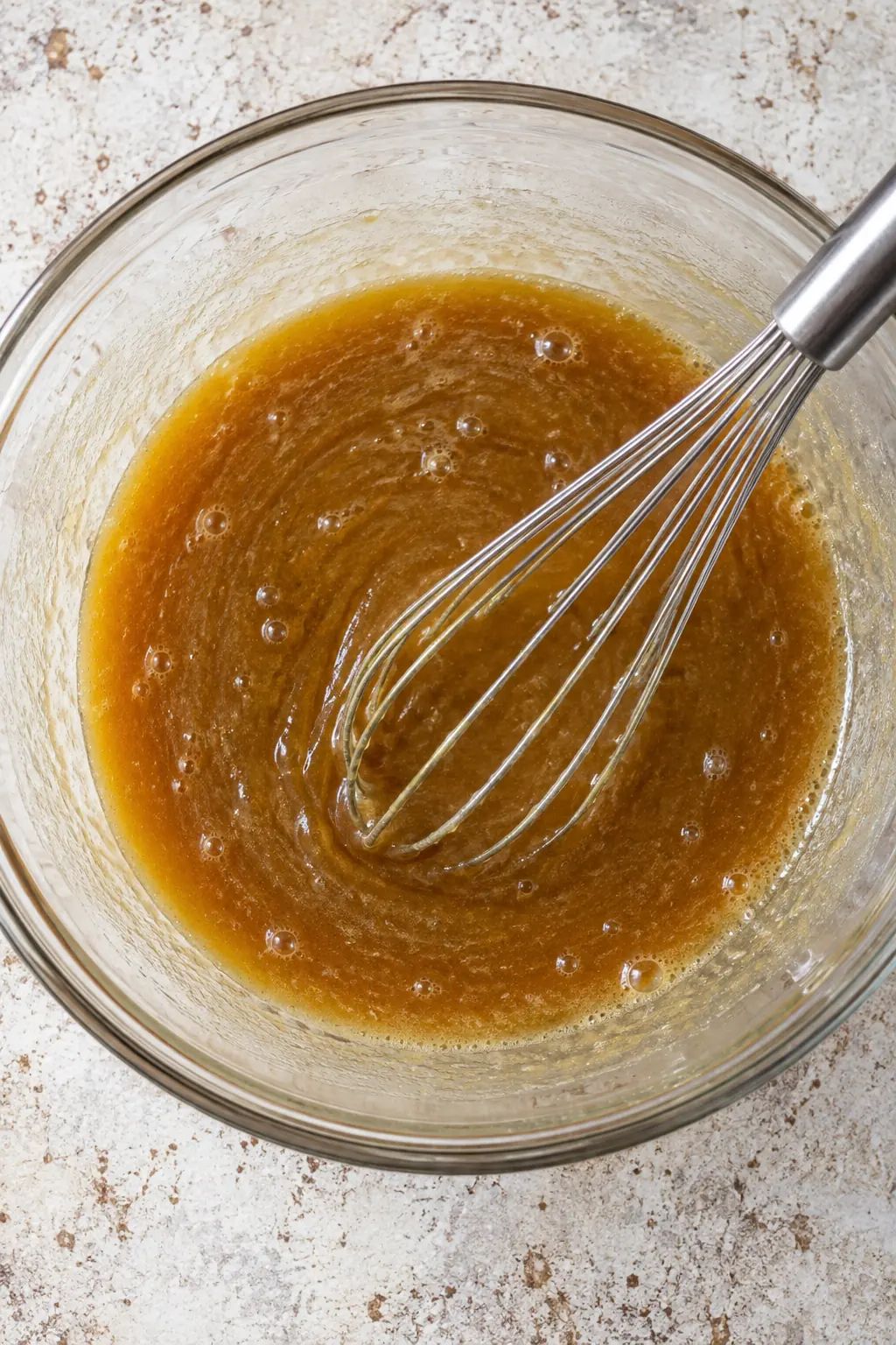 Brown sugar, corn syrup, butter, eggs, vanilla, and salt whisked into an amber filling