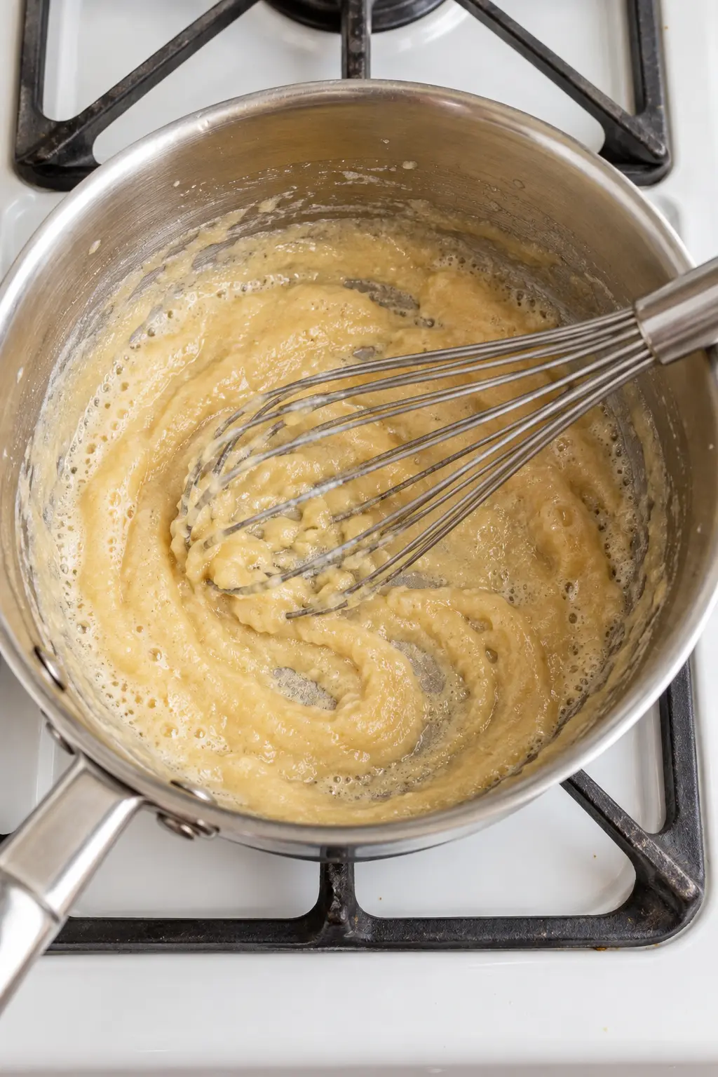 Butter and flour whisked into a pale roux in a saucepan