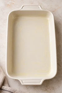 Empty rectangular baking dish lightly greased with melted butter