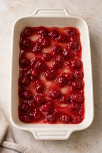One can of cherry pie filling spread in a thin layer in the baking dish