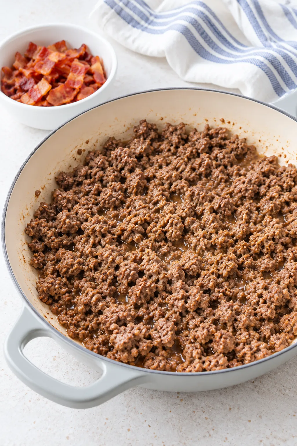 Ground beef browned in a skillet for Low-Carb Bacon Cheeseburger Casserole