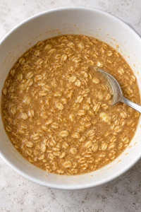 Loose brown sugar oatmeal pie filling with milk, beaten eggs, butter, and vanilla mixed in