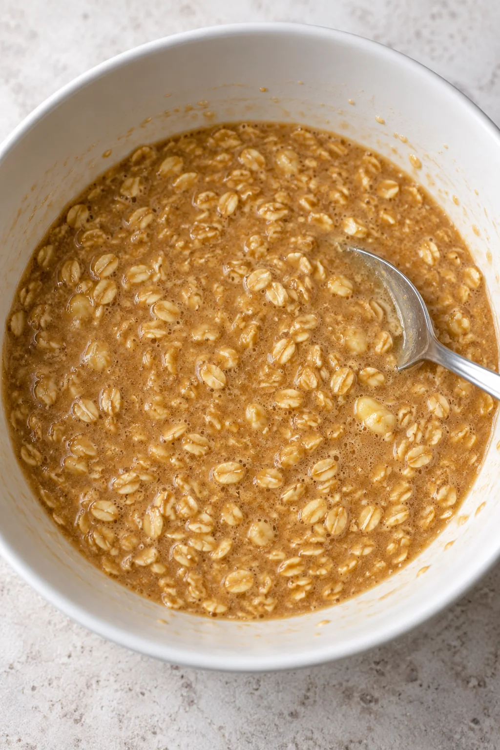 Loose brown sugar oatmeal pie filling with milk, beaten eggs, butter, and vanilla mixed in