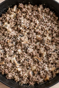 Ground beef and chopped mushrooms lightly coated with melted cream cheese