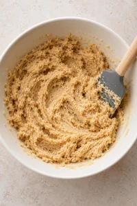 Softened butter, light brown sugar, and granulated sugar creamed into a fluffy pale tan mixture