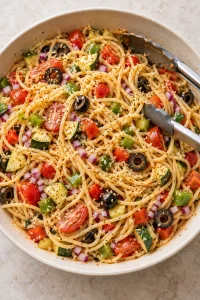 Spaghetti and vegetables evenly tossed with the Italian Parmesan dressing