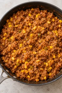 Seasoned beef filling with refried beans, corn, green chiles, and enchilada sauce mixed together
