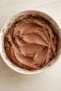 Smooth cocoa buttercream made for the optional chocolate-frosted sides