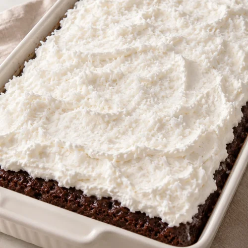 Whole Mounds cake with a white coconut whipped topping