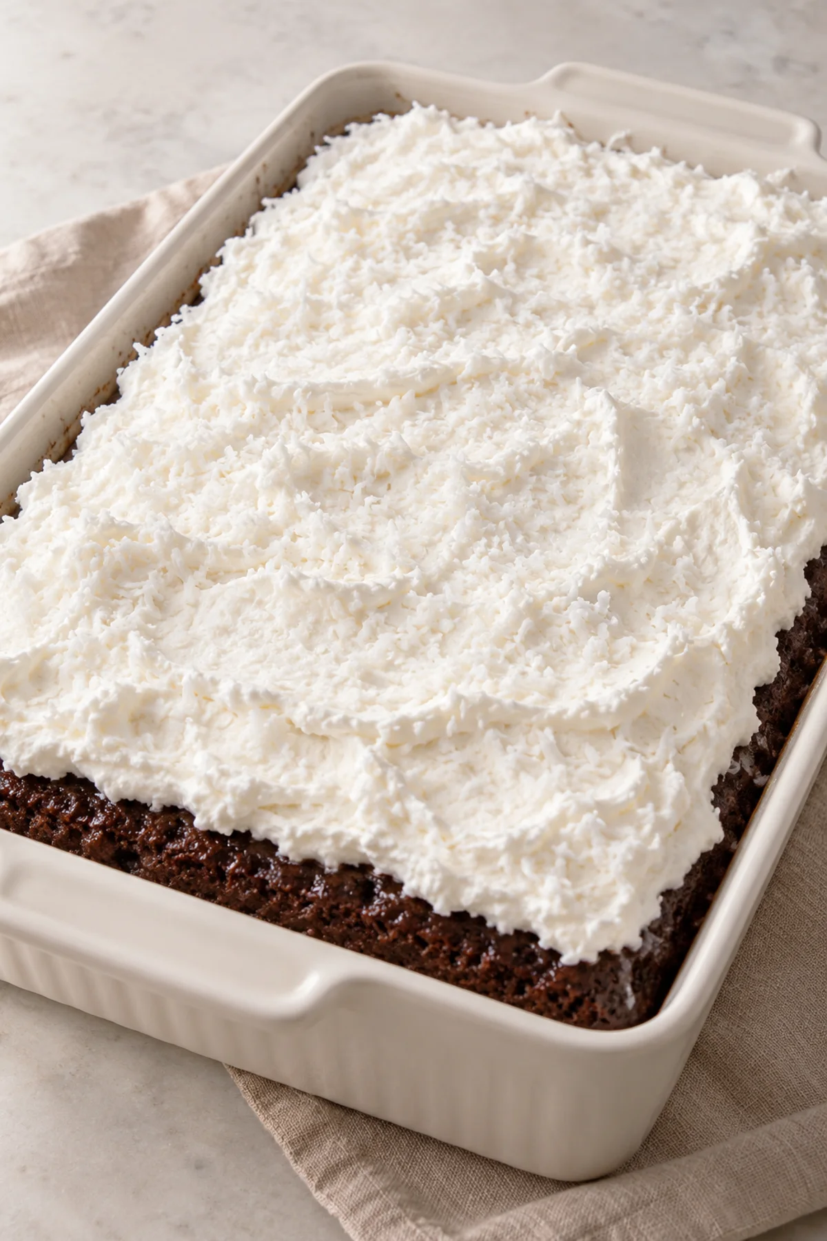 Whole Mounds cake with a white coconut whipped topping