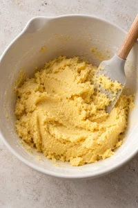 Thick yellow cake-mix crust dough in a mixing bowl