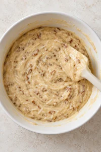 Butter pecan cake batter mixed with coconut pecan frosting and chopped pecans