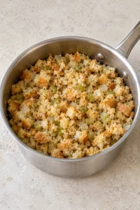 Moistened quick-cooking stuffing resting loosely in a saucepan